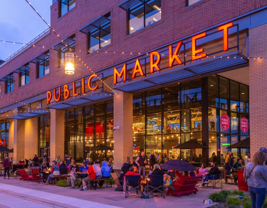Domain City Center Public Market signage at dusk with outdoor seating