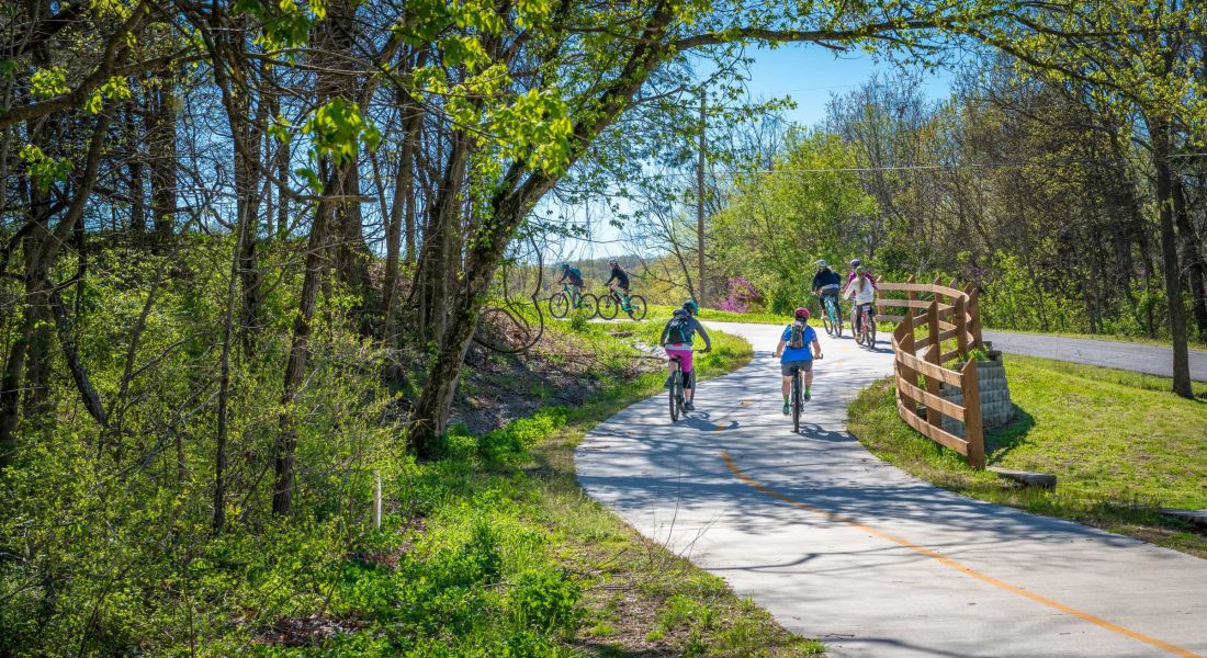 Domain City Center Family with kids biking on bike trail in Bella Vista, Northwest